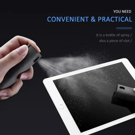 Hand spraying black screen cleaning spray onto tablet with microfiber cloth for dust removal demonstration