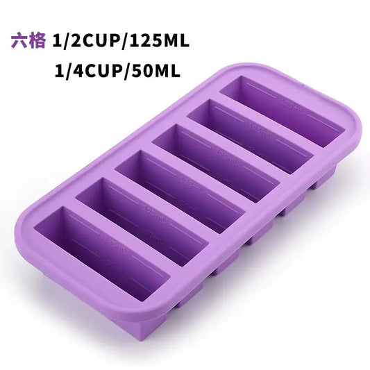 Purple silicone ice cube tray with six rectangular compartments and volume measurements printed inside each slot