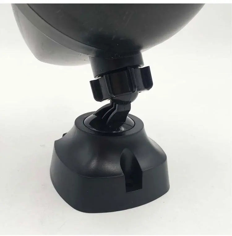 Close-up of black adjustable joint and base of LED sports security light with cable slot on white background