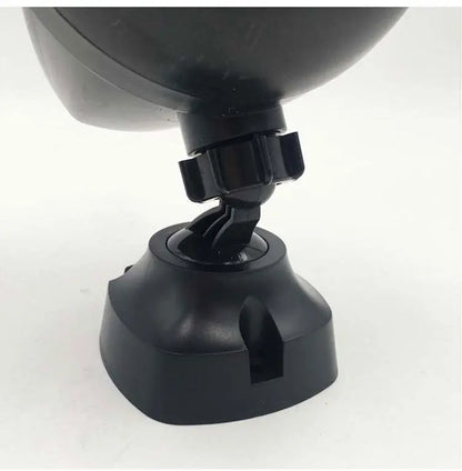 Close-up of black adjustable joint and base of LED sports security light with cable slot on white background