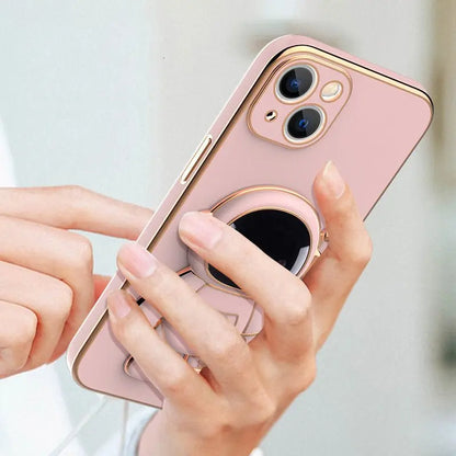 Close-up of pink iPhone case with 3D astronaut electroplating bracket and anti-drop protective design in hand