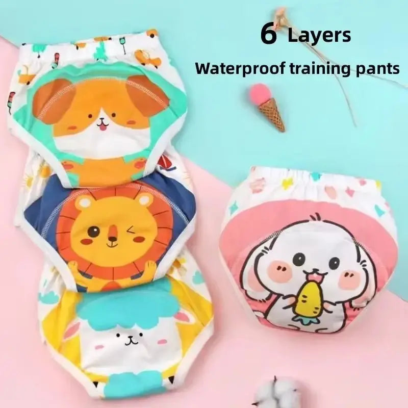 Four colorful baby waterproof training pants with cartoon animal prints in orange, blue, pink, and white designs.