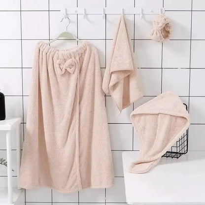 Set of 4 beige microfiber towels including bath skirt, face towel, hair towel, and scrunchie hanging on white hooks