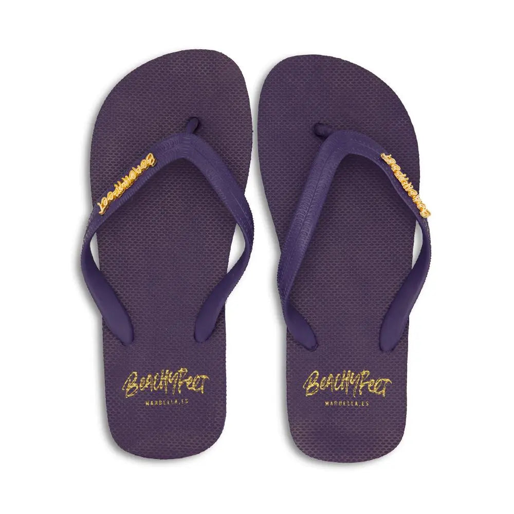Pair of navy blue BeachyFeet® men's flip flops with textured sole and yellow logo on straps and footbed