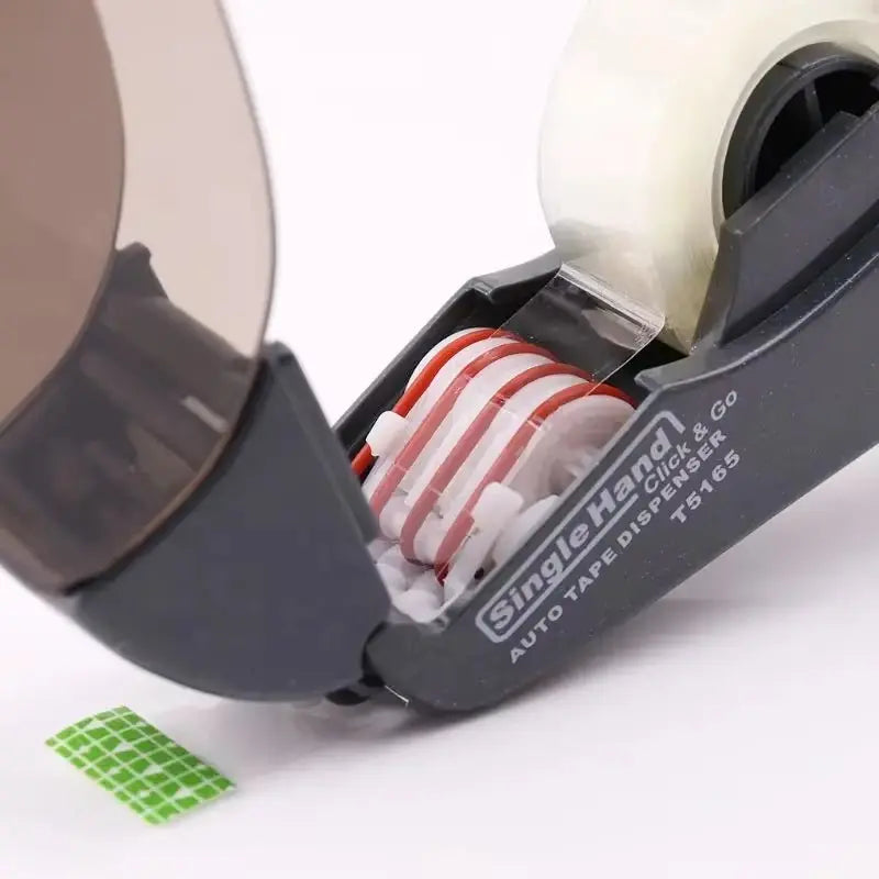 Close-up of SingleHand automatic tape dispenser with press cutter and transparent tape roll on white background