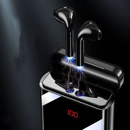Close-up of black Bluetooth headset earbuds charging inside sleek power bank case with digital battery display at 100 percent
