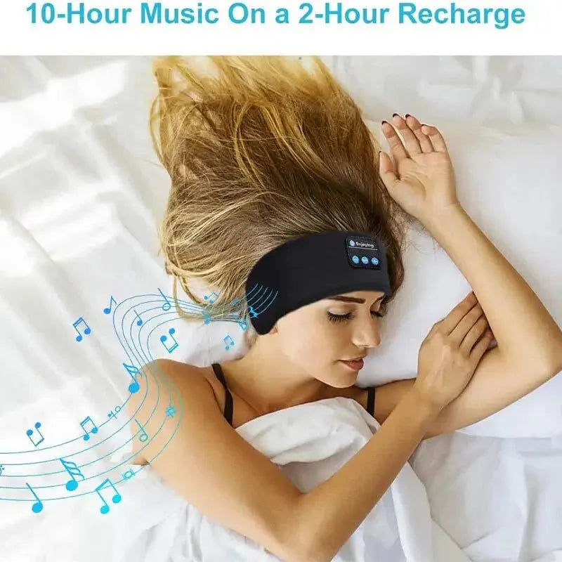 Woman lying on bed wearing black Bluetooth sleep headband with built-in speakers and control buttons visible