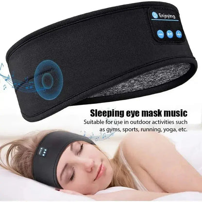 Black Bluetooth sleep headband with built-in speakers and wireless control buttons shown worn by sleeping woman