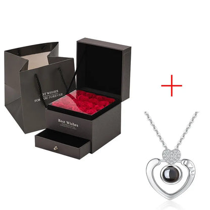 Gift set with black box of preserved red roses and silver heart pendant necklace for Valentine's Day