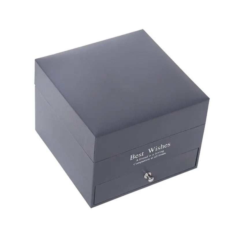 Dark grey square jewelry gift box with silver knob and "Best Wishes" text on front side