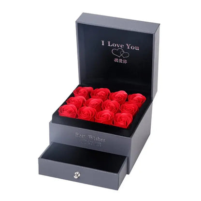 Black gift box with 9 red roses, "I Love You" message inside lid, and small drawer below the roses