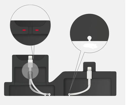 Close-up of black 3-in-1 mobile phone charging base showing cable management details for Apple device connectors