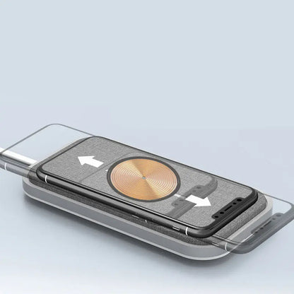 Close-up of universal wireless fast charger pad with smartphone demonstrating automatic alignment arrows on screen