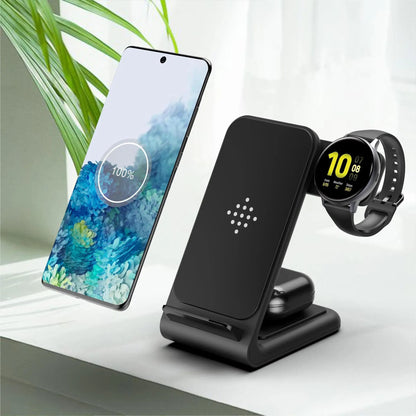 Black three-in-one fast wireless charger bracket charging a smartphone, smartwatch, and wireless earbuds case