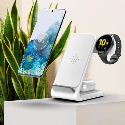 White fast wireless charger three-in-one stand with smartphone, smartwatch, and earbuds charging on minimalist surface