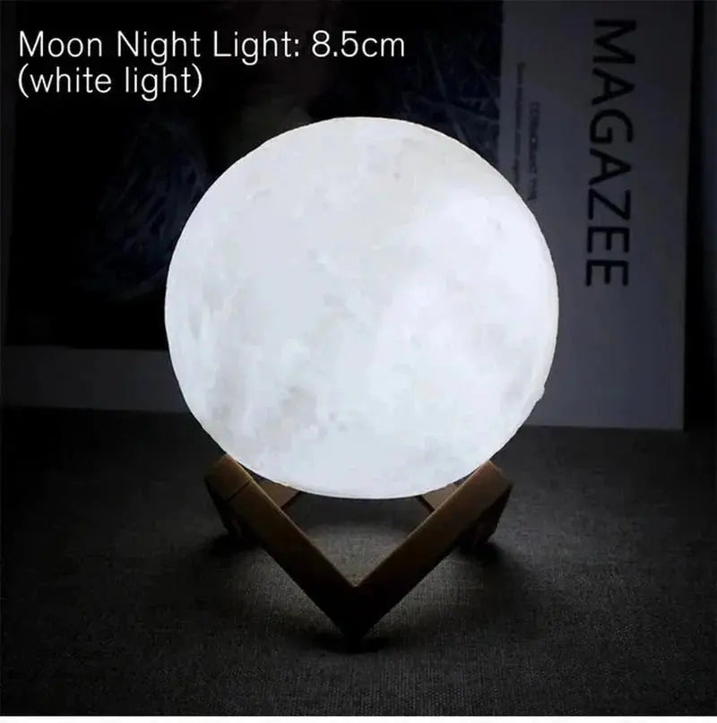 D5 Starry Moon Lamp 8.5cm emitting white light on wooden stand against dark background with MAGAZEE text in back