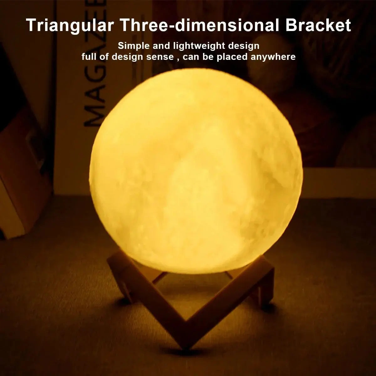 D5 Starry Moon Lamp 8cm glowing warm yellow on triangular wooden stand with textured lunar surface design