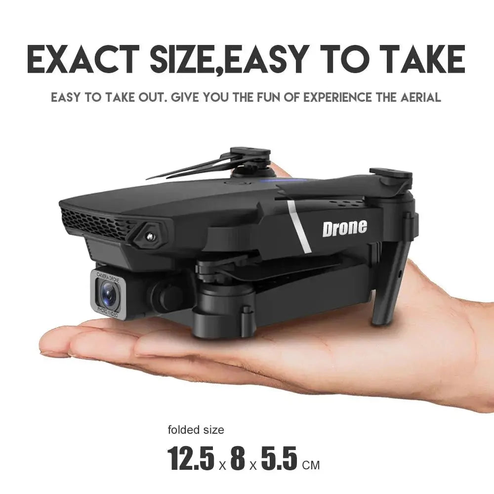 Compact black E88 Pro foldable quadcopter drone with HD 4K camera resting on an open palm.