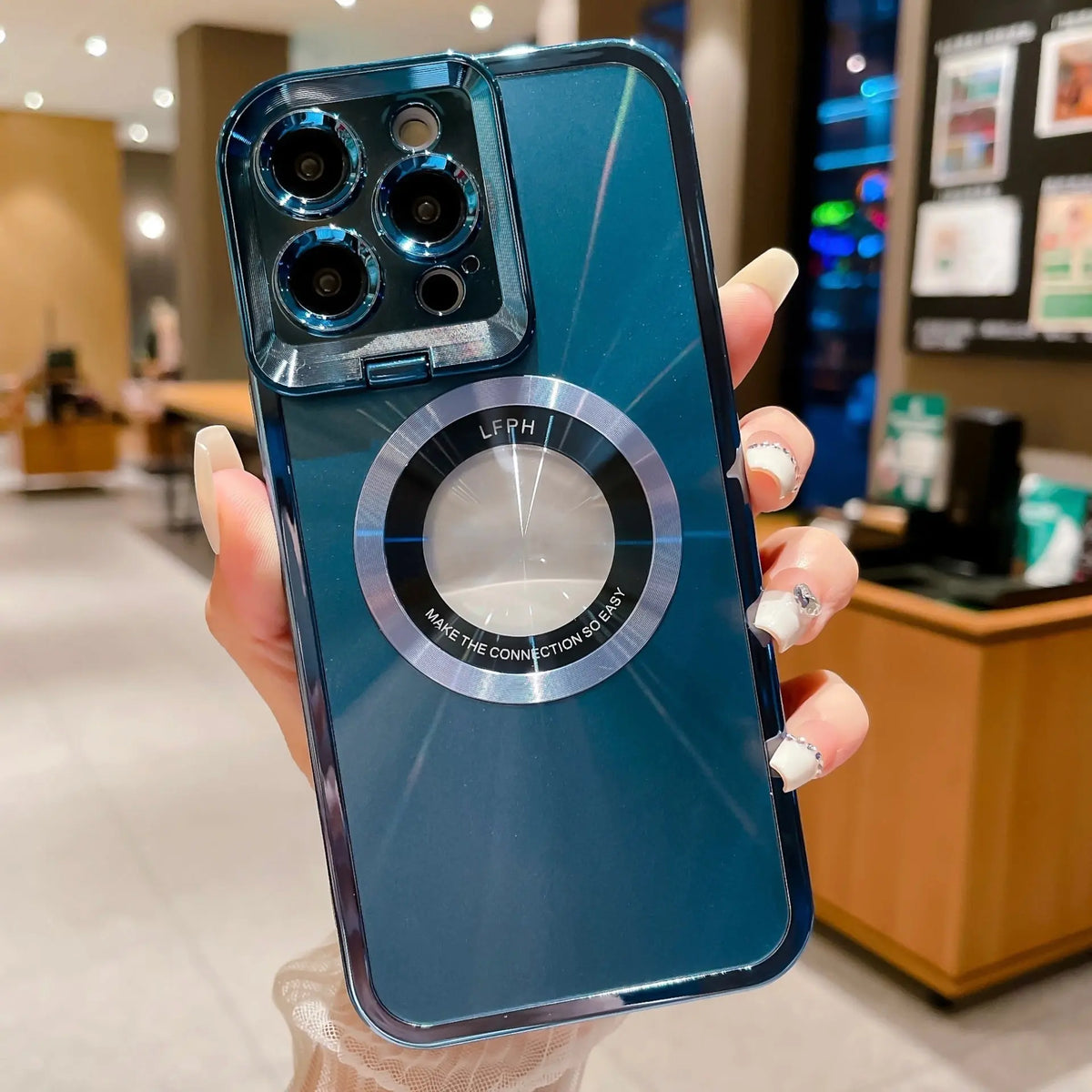 Hand holding blue electroplated phone case with CD pattern and magnetic ring for iPhone 12 13 14 Pro Max models