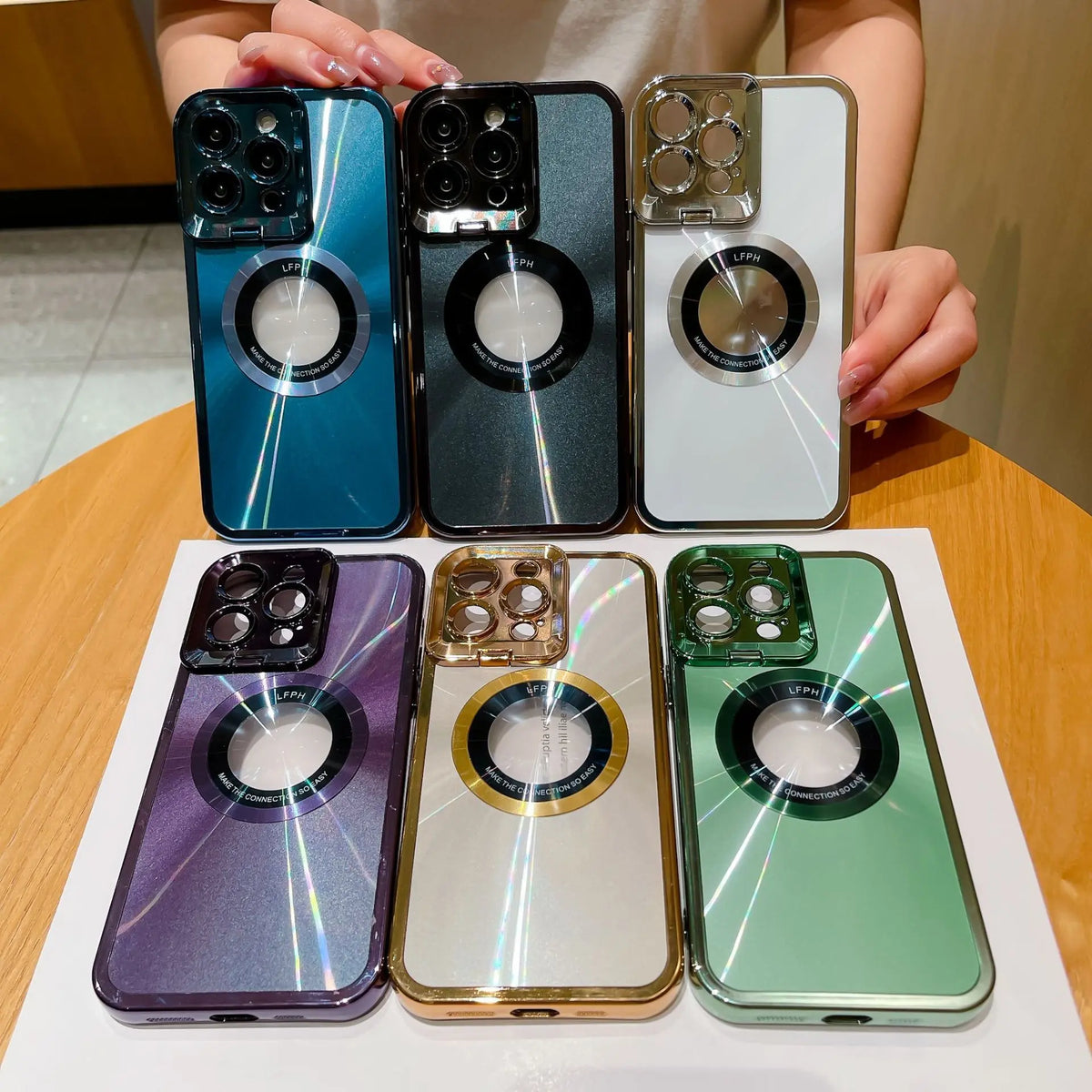 Six electroplated phone cases with CD pattern and magnetic lens holder for iPhone 12 13 14 Pro Max in multiple colors