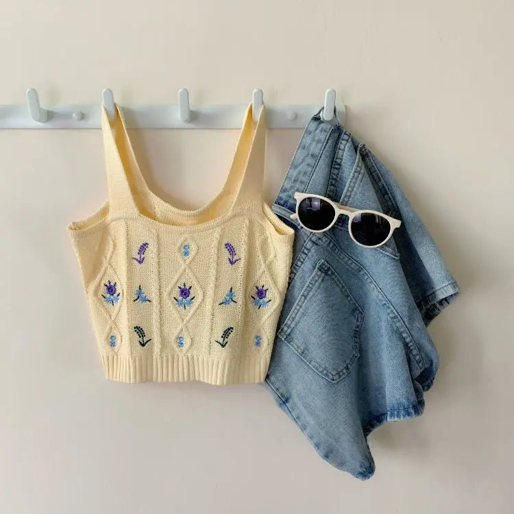 Apricot knit Hyuna style crop top with purple floral embroidery paired with light blue denim jacket and white sunglasses