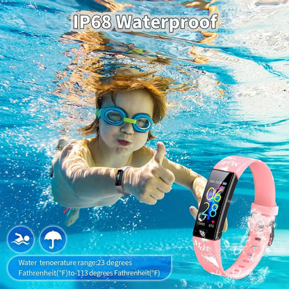 Underwater view of child wearing pink kids fitness tracker smartwatch showing IP68 waterproof feature with thumbs up gesture