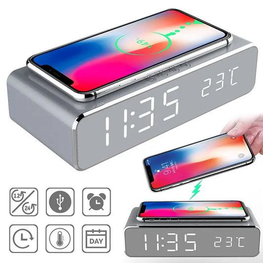 Silver LED digital alarm clock with wireless phone charging, touchscreen buttons, and temperature display on mirror screen