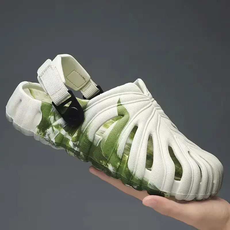 Side view of white and green monstera leaf patterned platform slip-on slipper with adjustable heel strap