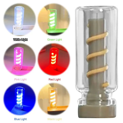 Close-up of mechanical flip flexible light showing spiral bulb with color options of white, green, pink, red, blue, and warm light