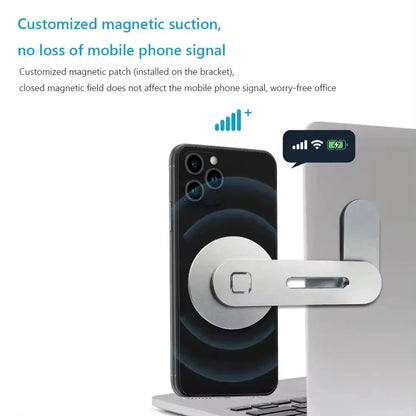 Close-up of metal magnetic phone stand attached to laptop with smartphone showing full signal and charging icon