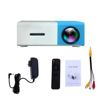 Mini portable LED projector in white and blue with remote, power adapter, RCA cable, and user guide displayed on white background