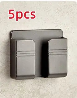 Black punch-free sticky mobile phone charging storage rack with dual slots mounted on wall