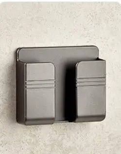 Black punch-free sticky mobile phone charging storage rack with two compartments mounted on wall