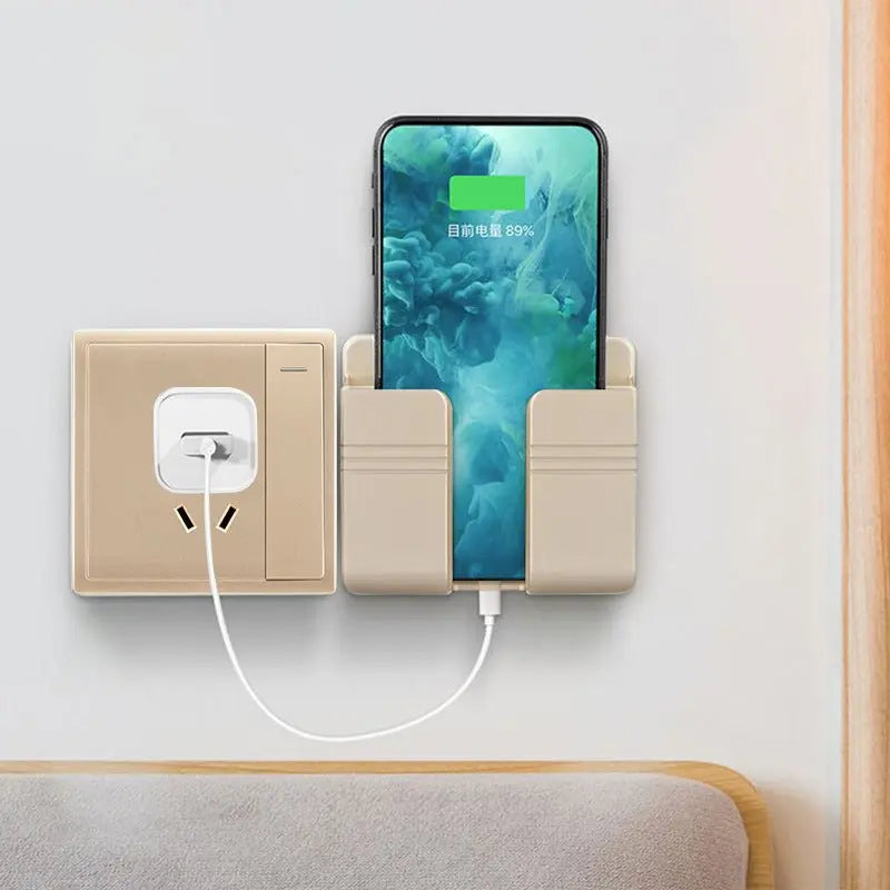 Beige punch-free sticky mobile phone charging storage rack mounted on wall holding phone while charging