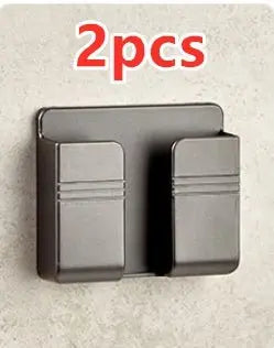 Black punch-free sticky mobile phone charging storage rack with dual slots mounted on wall, set of 2 pieces