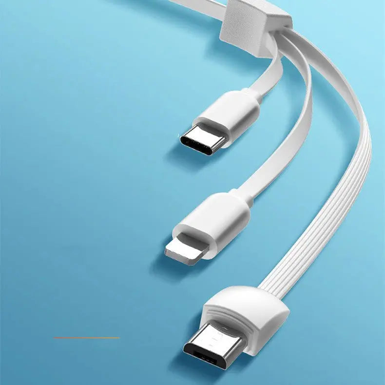 Close-up of white multifunctional charging cable with USB-C, Lightning, and Micro-USB connectors on blue background