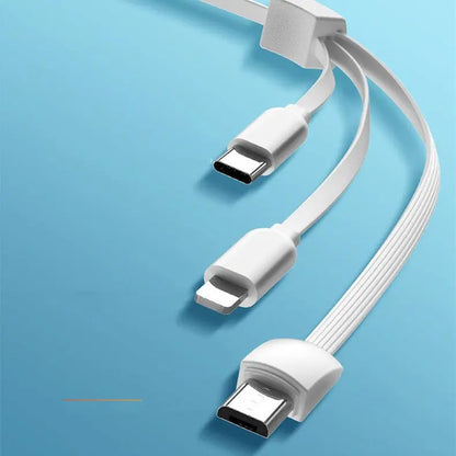 Close-up of white multifunctional charging cable with USB-C, Lightning, and Micro-USB connectors on blue background