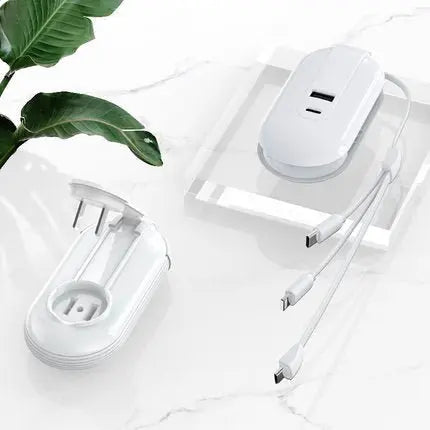 White Mobile Phone Multifunctional One For Three Chargers with retractable plug and multiple charging cables on marble surface
