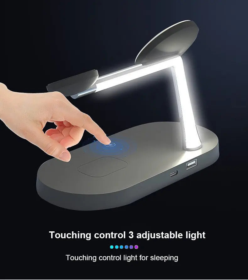 Hand touching control button on black multifunctional wireless charging desk lamp with adjustable light panel