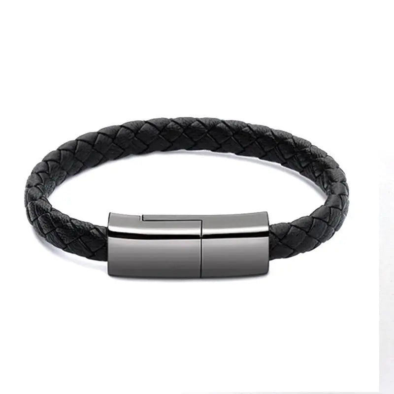 Black braided leather bracelet charger with sleek metallic USB charging clasp closed on white background