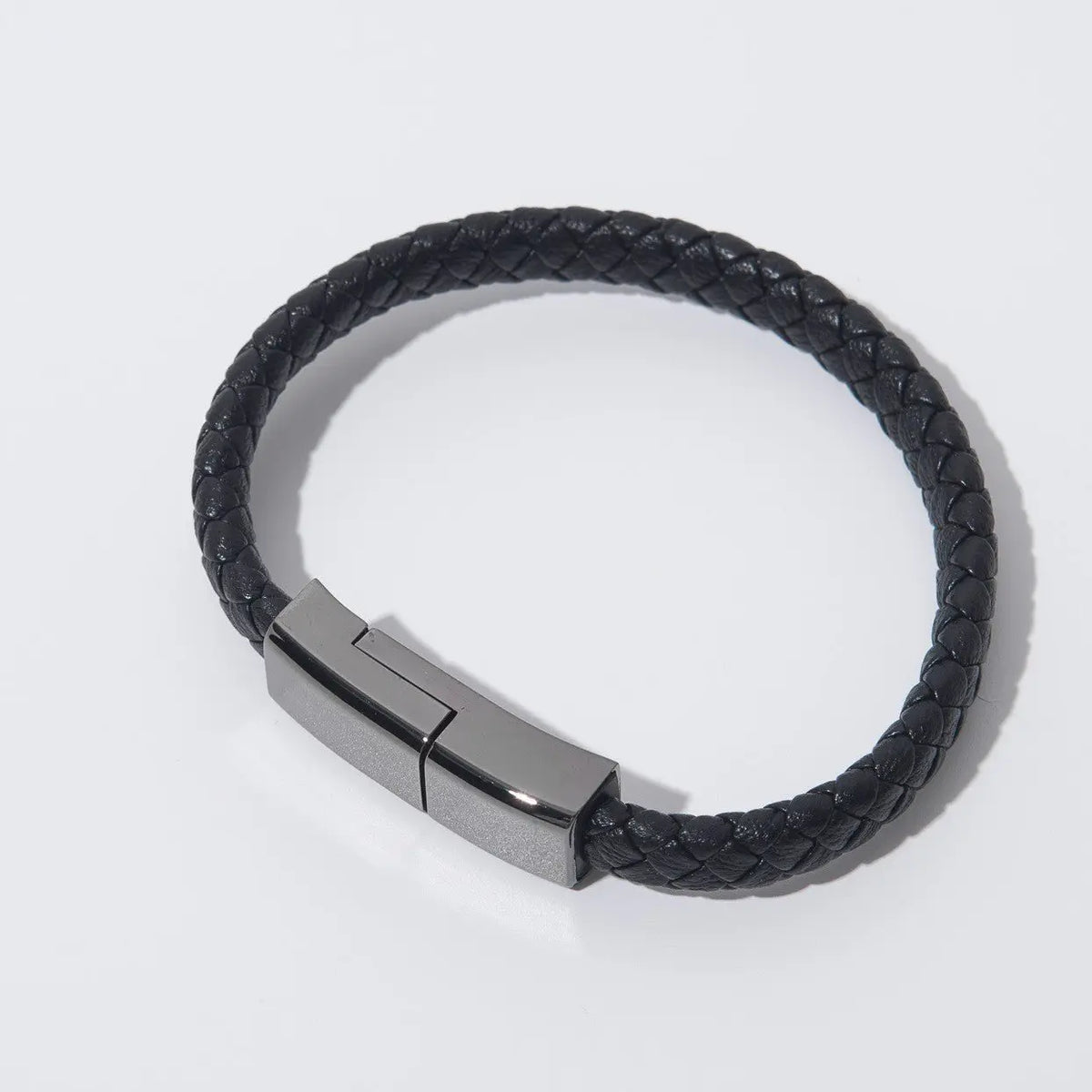 Black braided leather bracelet charger with sleek metallic USB charging clasp for iPhone and USB-C devices