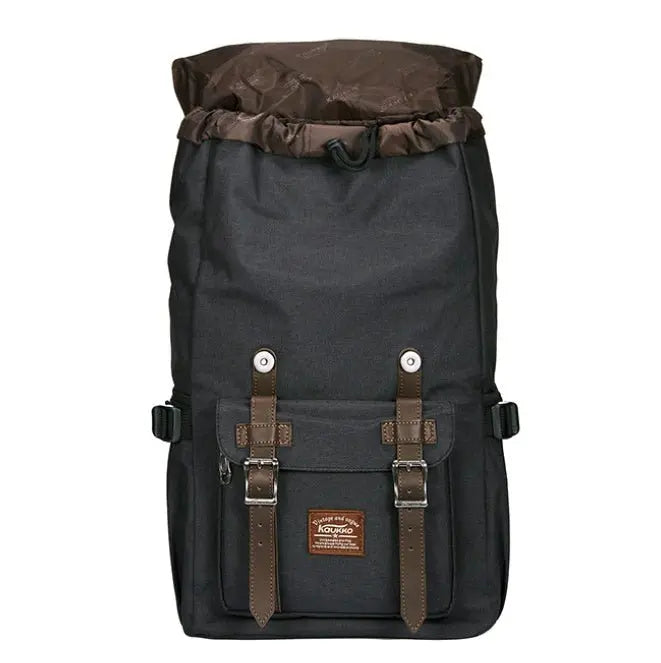 Front view of men's black linen oxford cloth backpack with brown soft handle and buckle straps