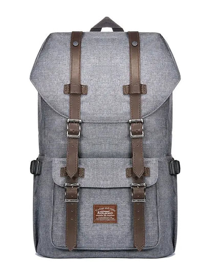Front view of casual grey linen oxford backpack for men with brown leather straps and front buckle pocket