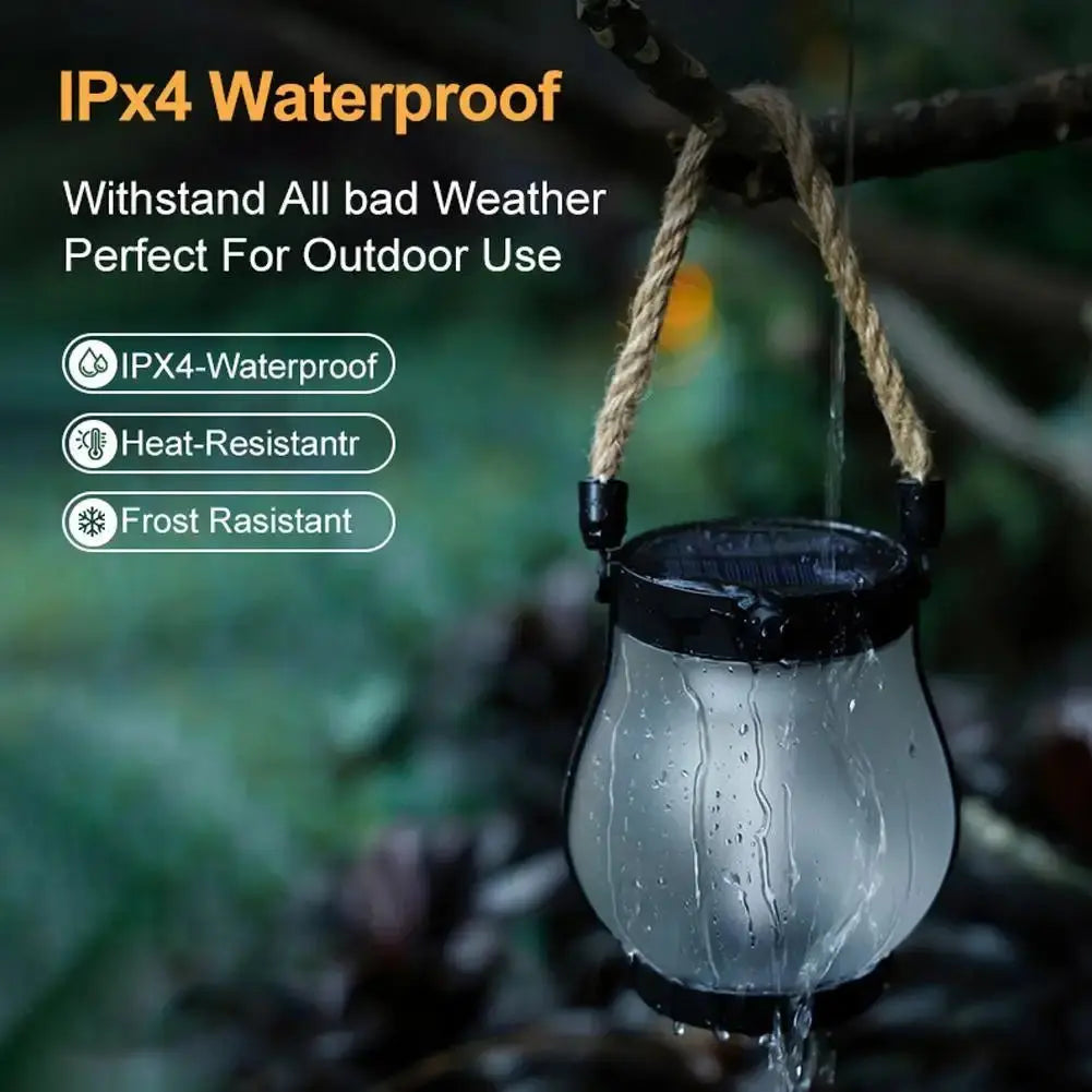 Solar Flame Lamp hanging from tree branch with water droplets highlighting IPX4 waterproof and heat-resistant features
