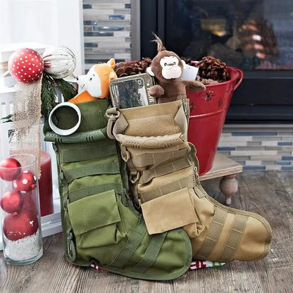 Pair of tactical MOLLE Christmas stockings in green and tan with stuffed toys and outdoor gear inside