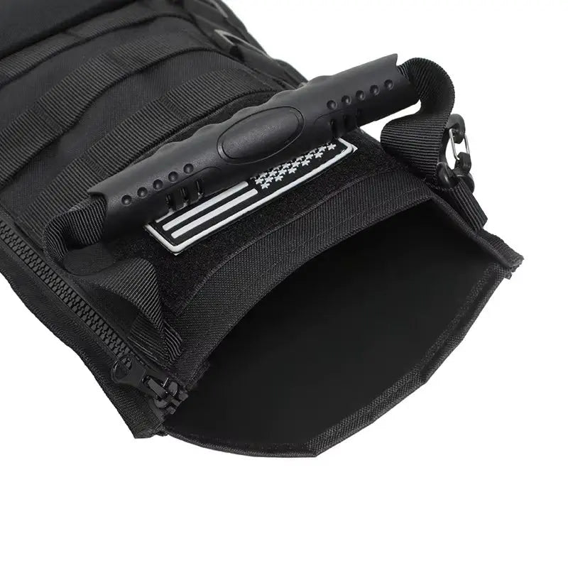 Close-up of black tactical molle Christmas stocking pouch with zipper, handle, and Velcro patch for outdoor or hunting use