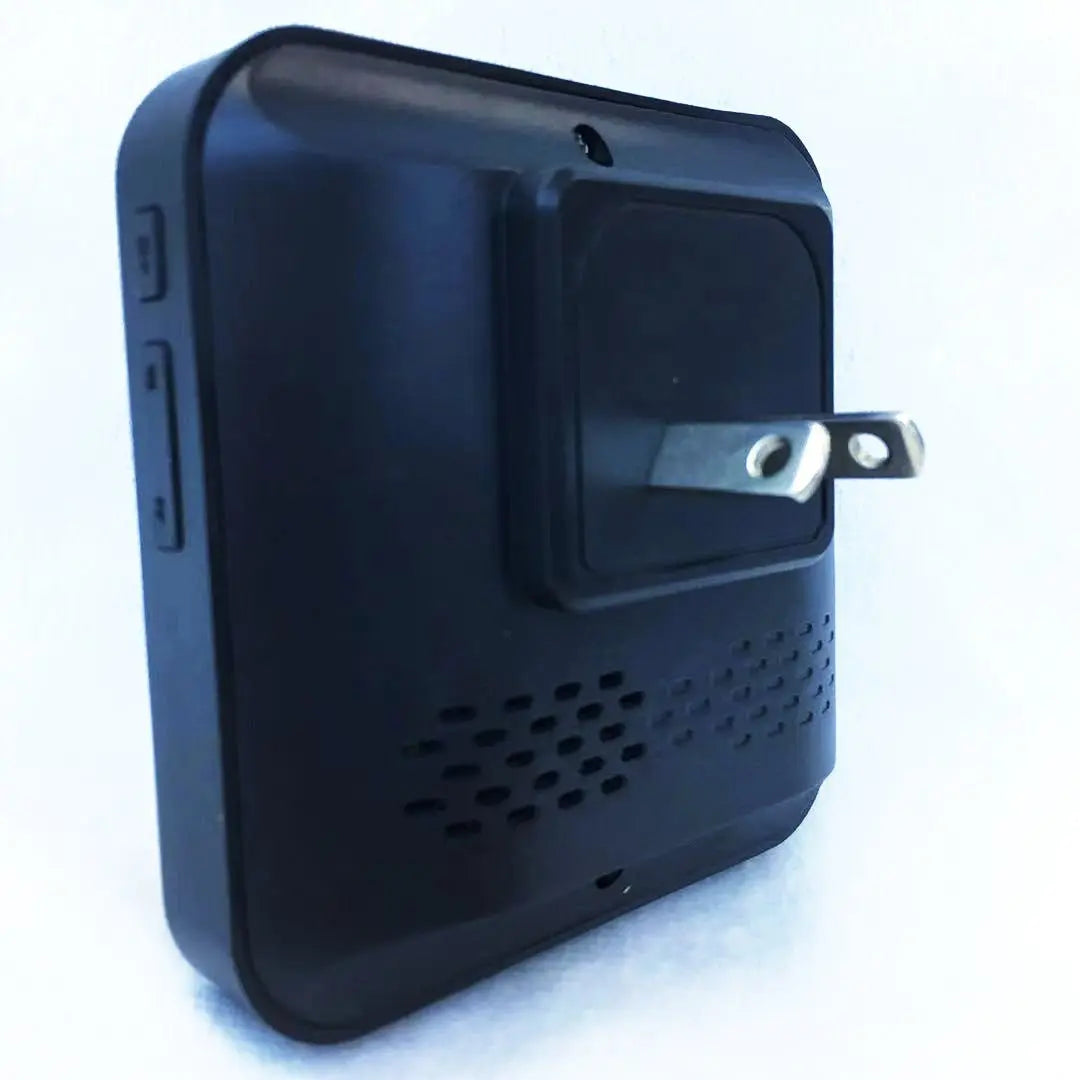 Back view of black compact wireless security doorbell chime with power plug and side control buttons