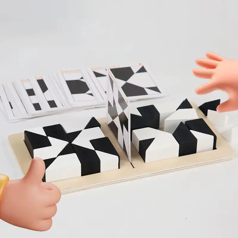 Top view of white and black wooden tangram blocks arranged on board with hands playing the 2-player puzzle game