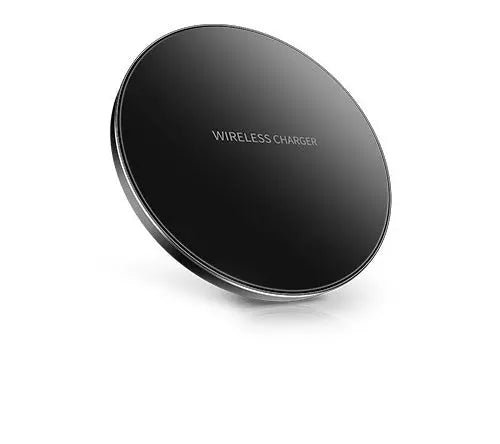 Minimalist black circular wireless charger pad with smooth surface and "WIRELESS CHARGER" text in the center